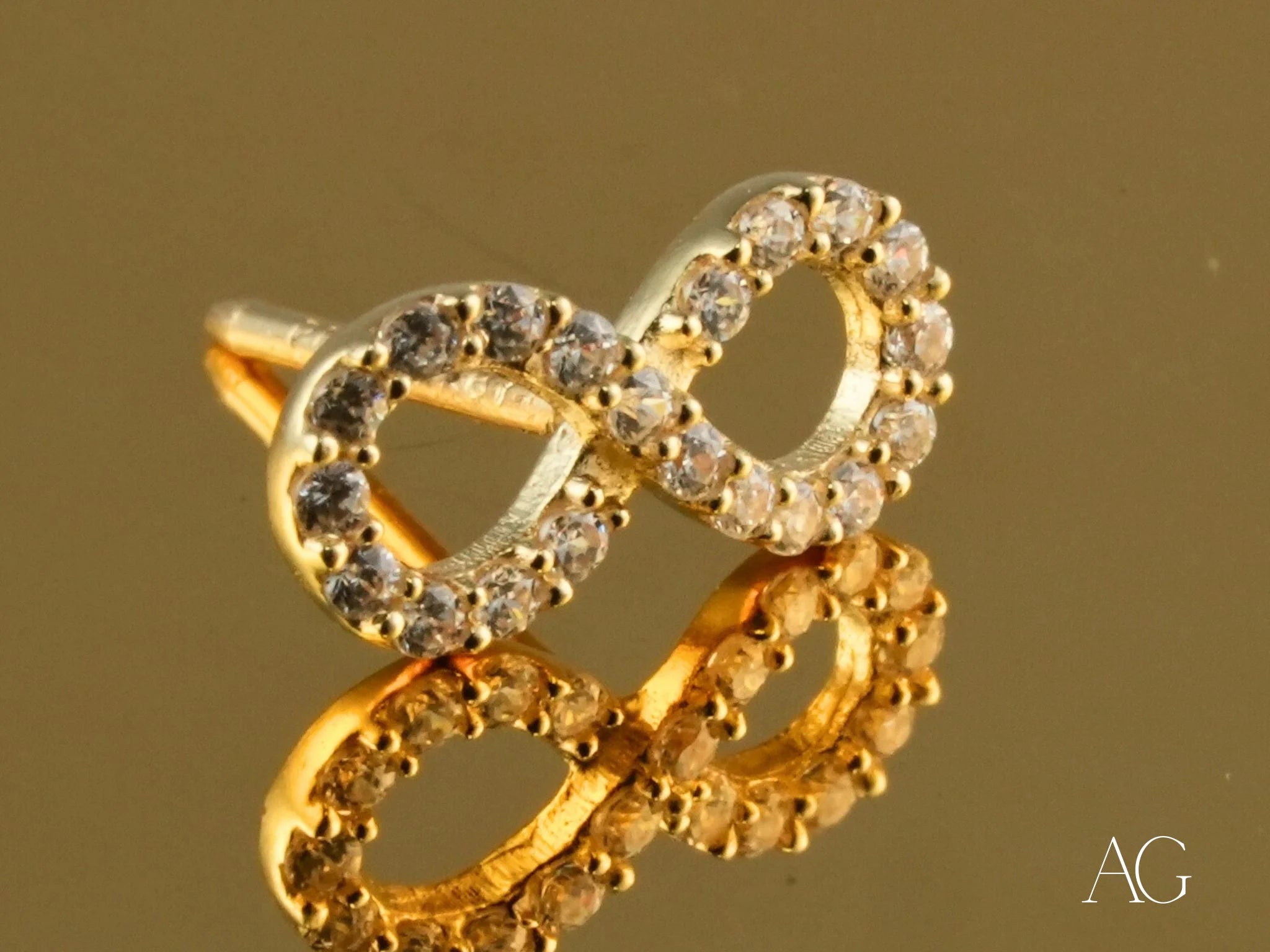 Gold infinity-shaped earrings with crystals from the Eternal Spark collection, 18K Gold