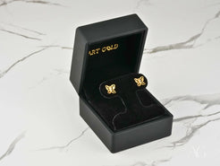 Gold CZ butterfly earrings in a black jewelry box, Ethereal Wings collection