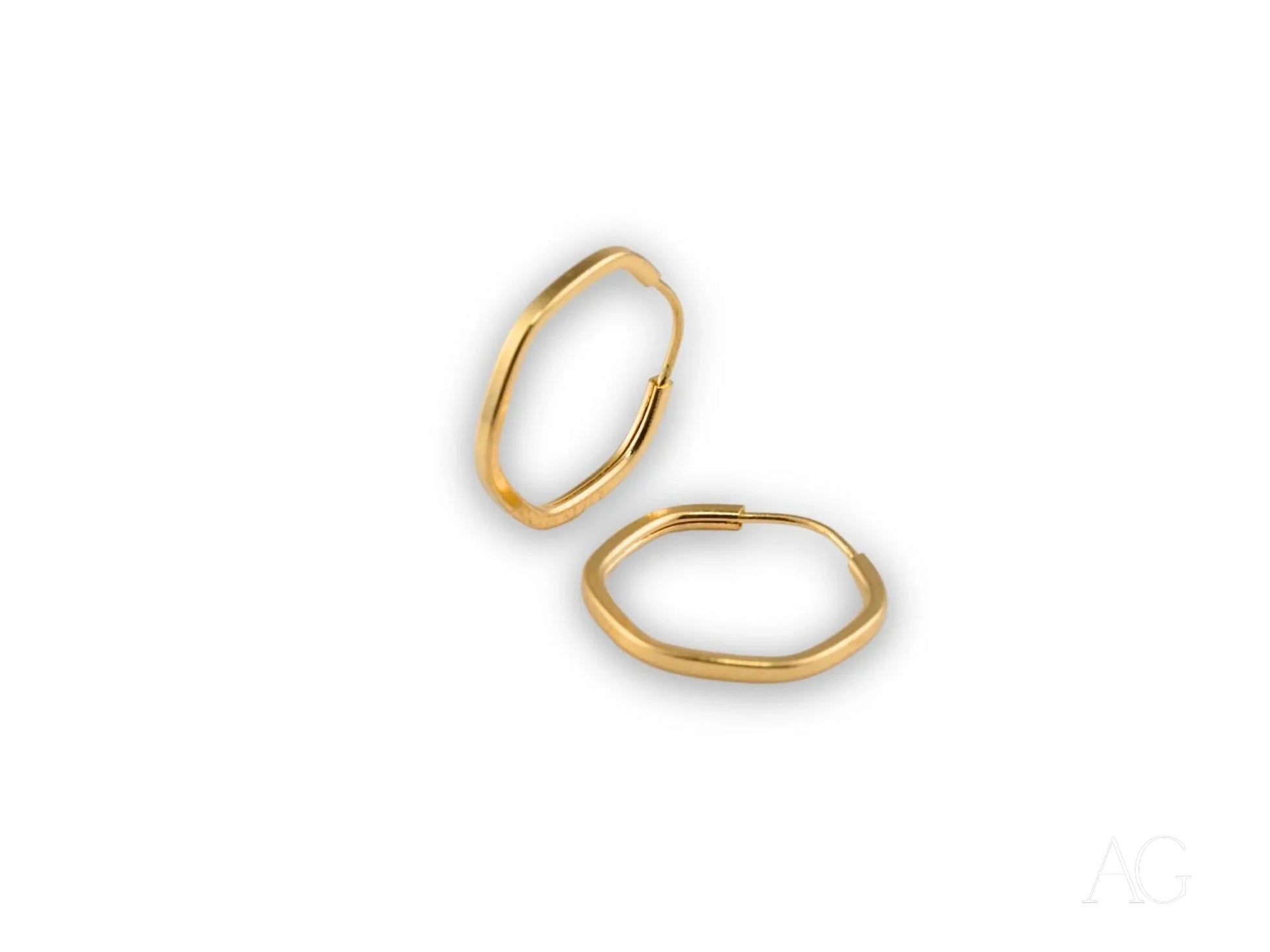 Two thin gold hoop earrings from Glimmergold 18k mini collection for everyday elegance