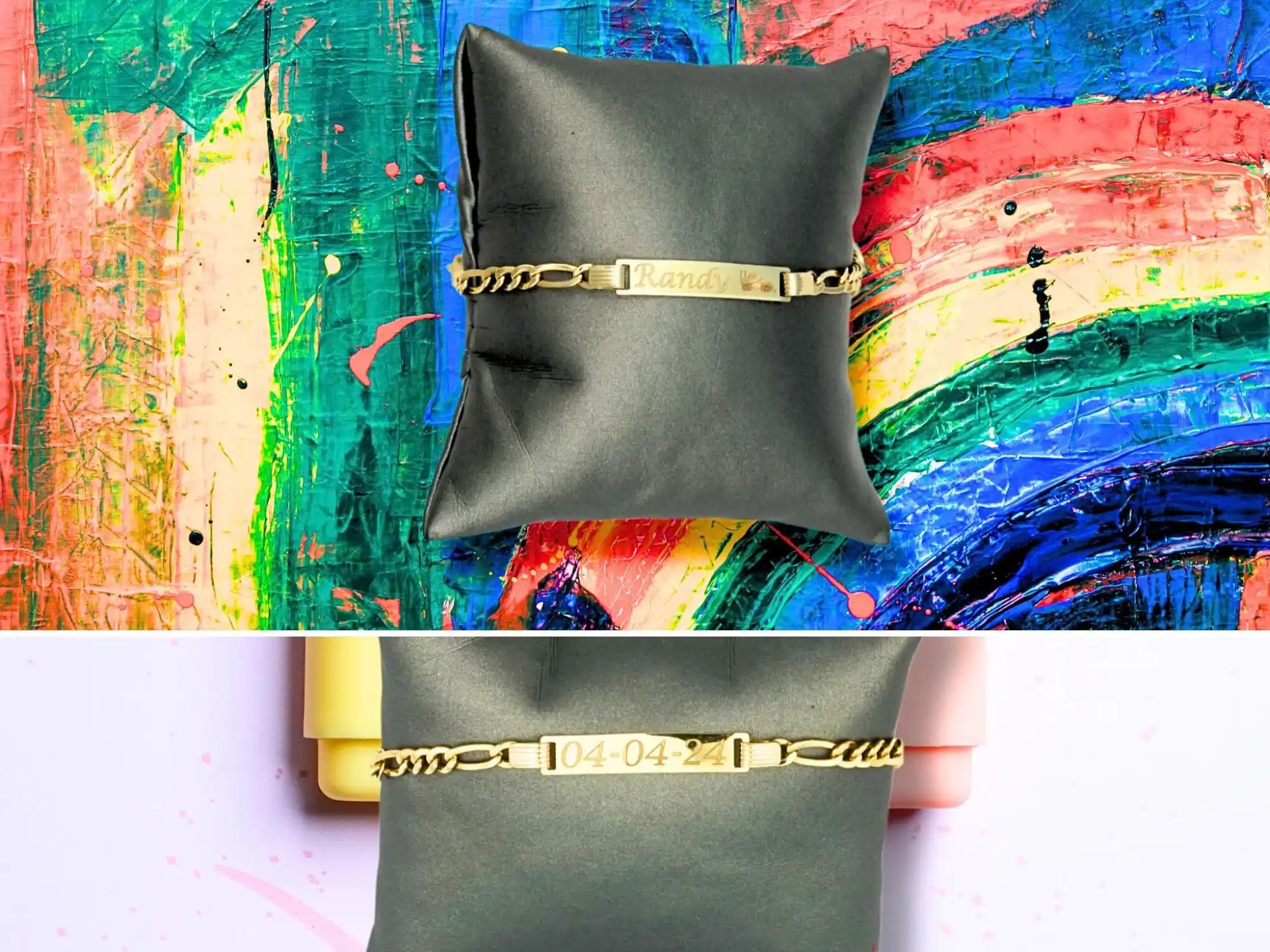 Gold-accented bracelet displayed on dark gray cushions.