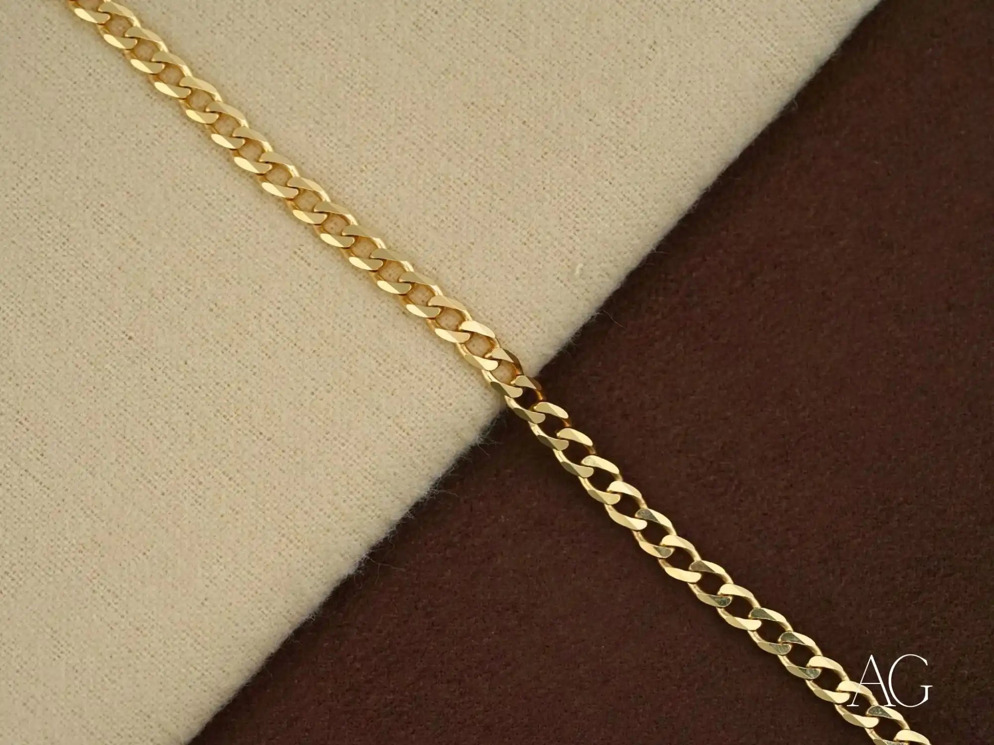 Gold-colored chain link necklace or bracelet.