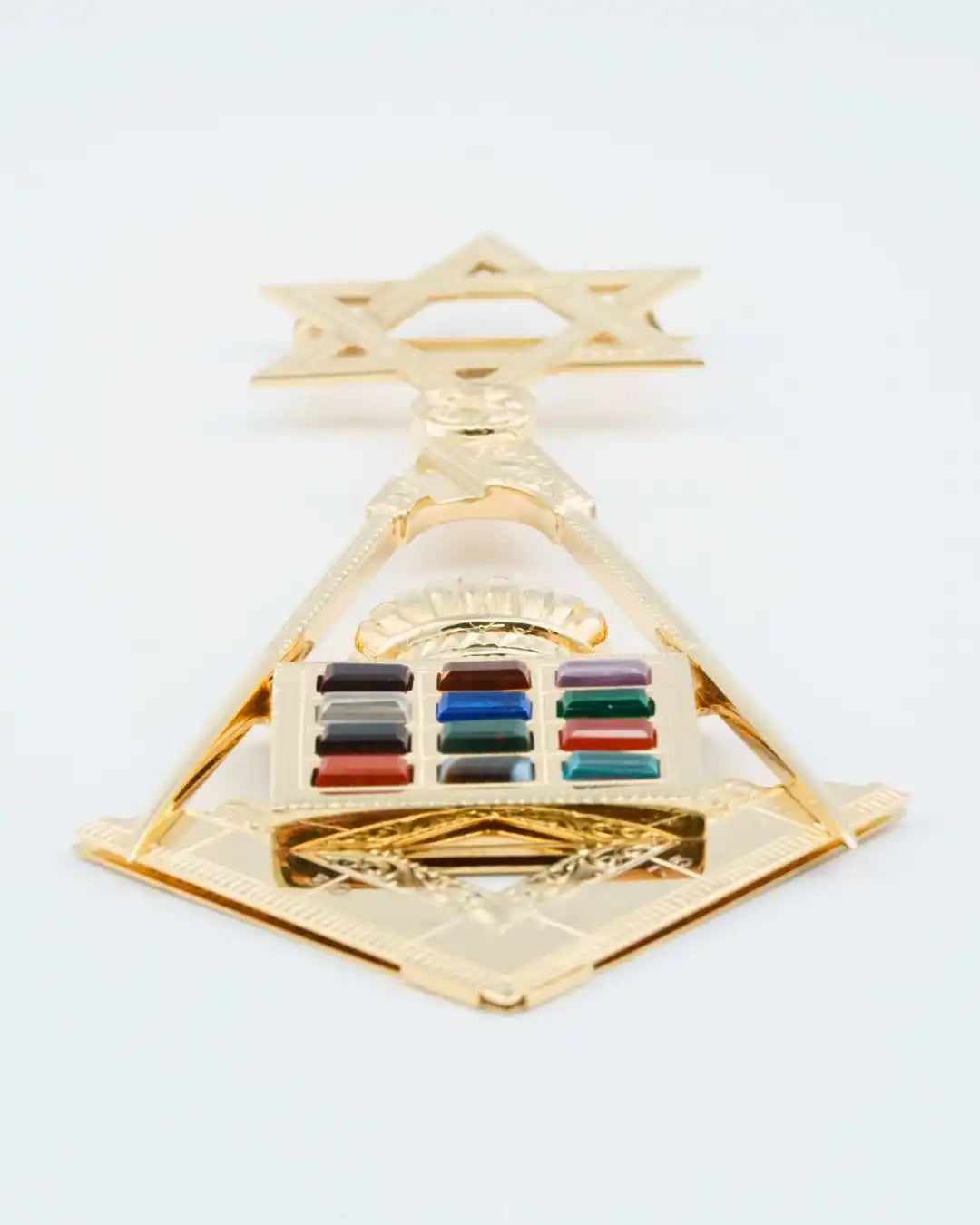 Gold-colored military rank insignia with colored bars in the center.