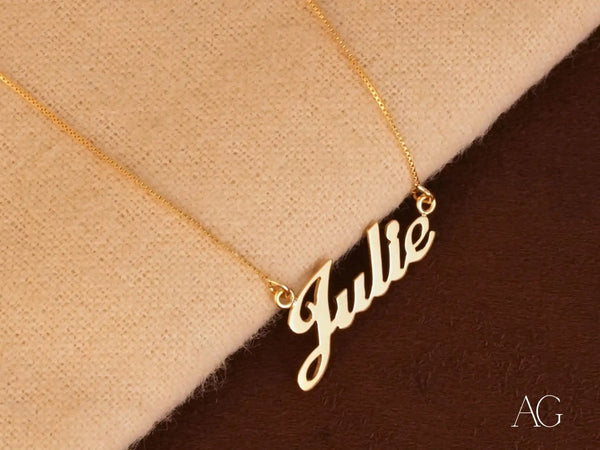 Gold ’Julie’ name necklace.