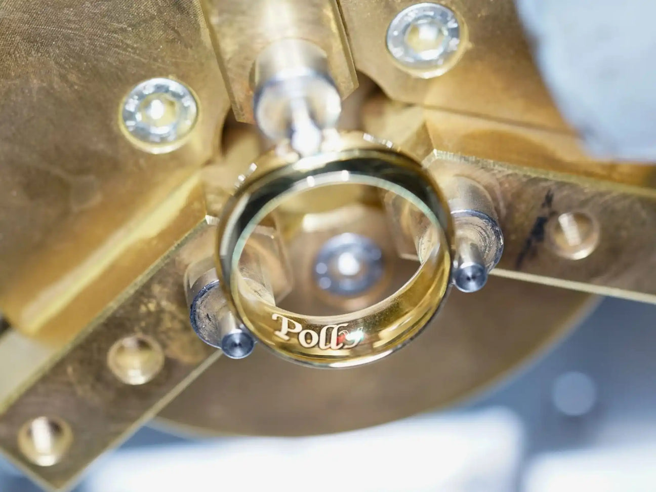 Gold ring with ’Polt’ engraved on it.