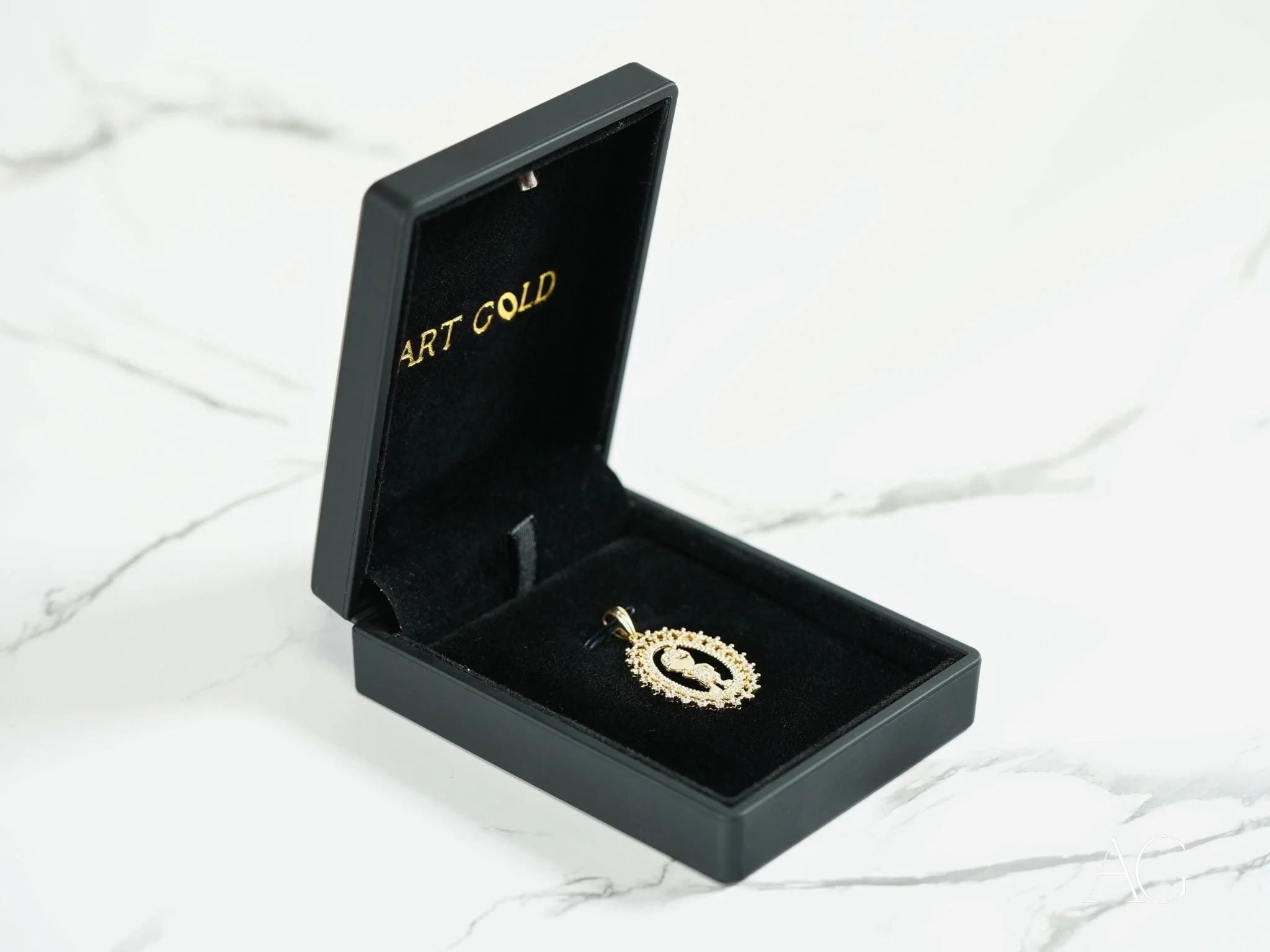 Black jewelry box showcasing a Golden Charm 18k Gold CZ Boy Pendant on velvet interior