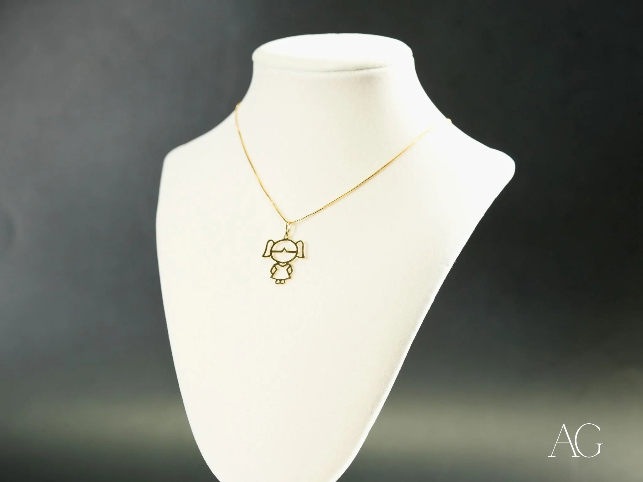 Gold necklace featuring a Golden Doll pendant in 18k Yellow or White Gold