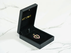 Heart-shaped red CZ pendant in 18k gold jewelry box for Golden Passion collection