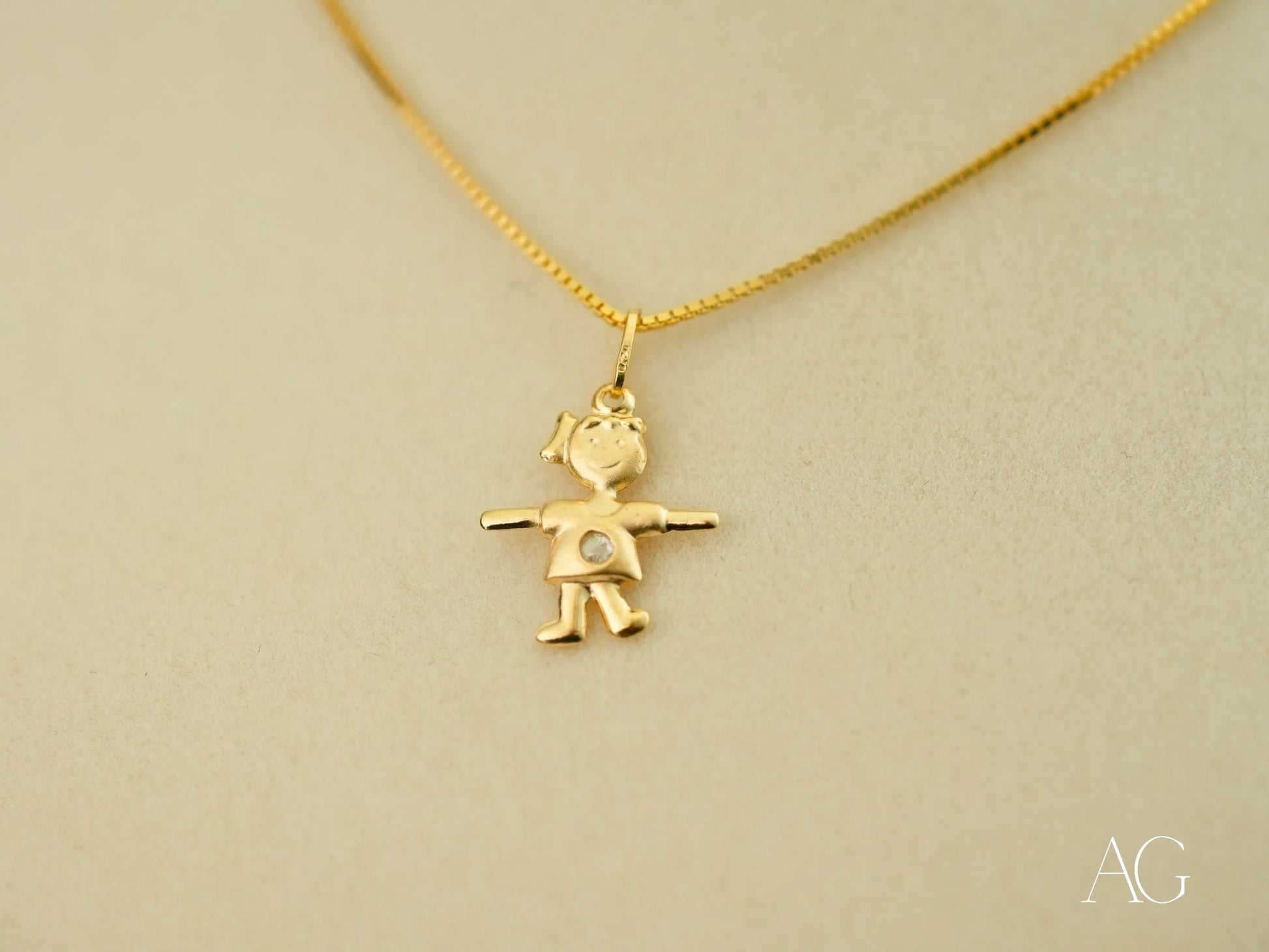 Gold pendant necklace with golden mini charm boy figure in 18k gold