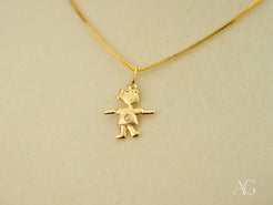 Gold pendant necklace with golden mini charm boy figure in 18k gold