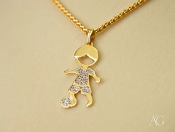 18k Gold pendant necklace featuring a boy with a soccer ball in Golden Moments design