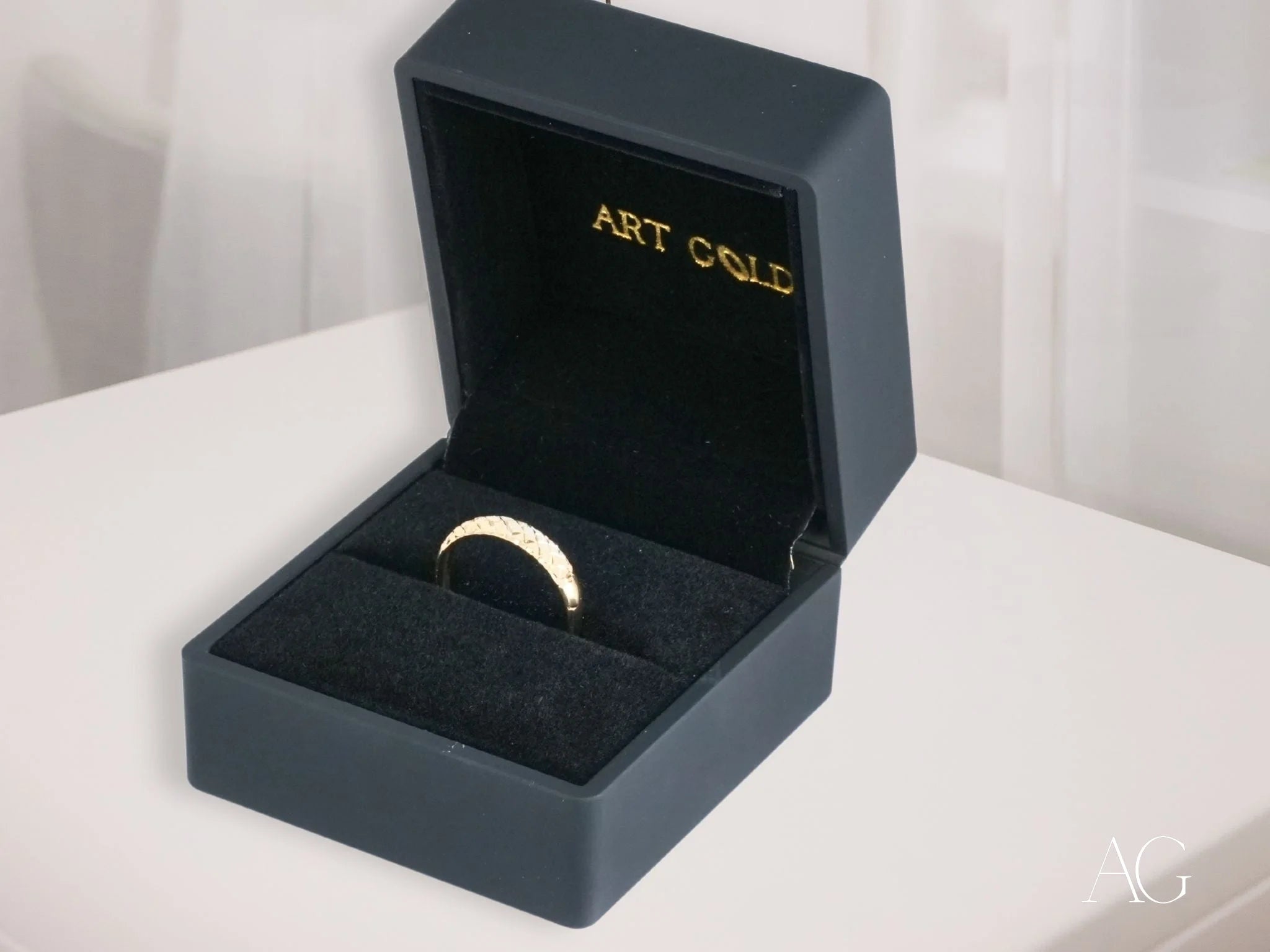 Gold ring in navy blue box with ART COLE label, featuring Golden Grace 18k Aparador Ring