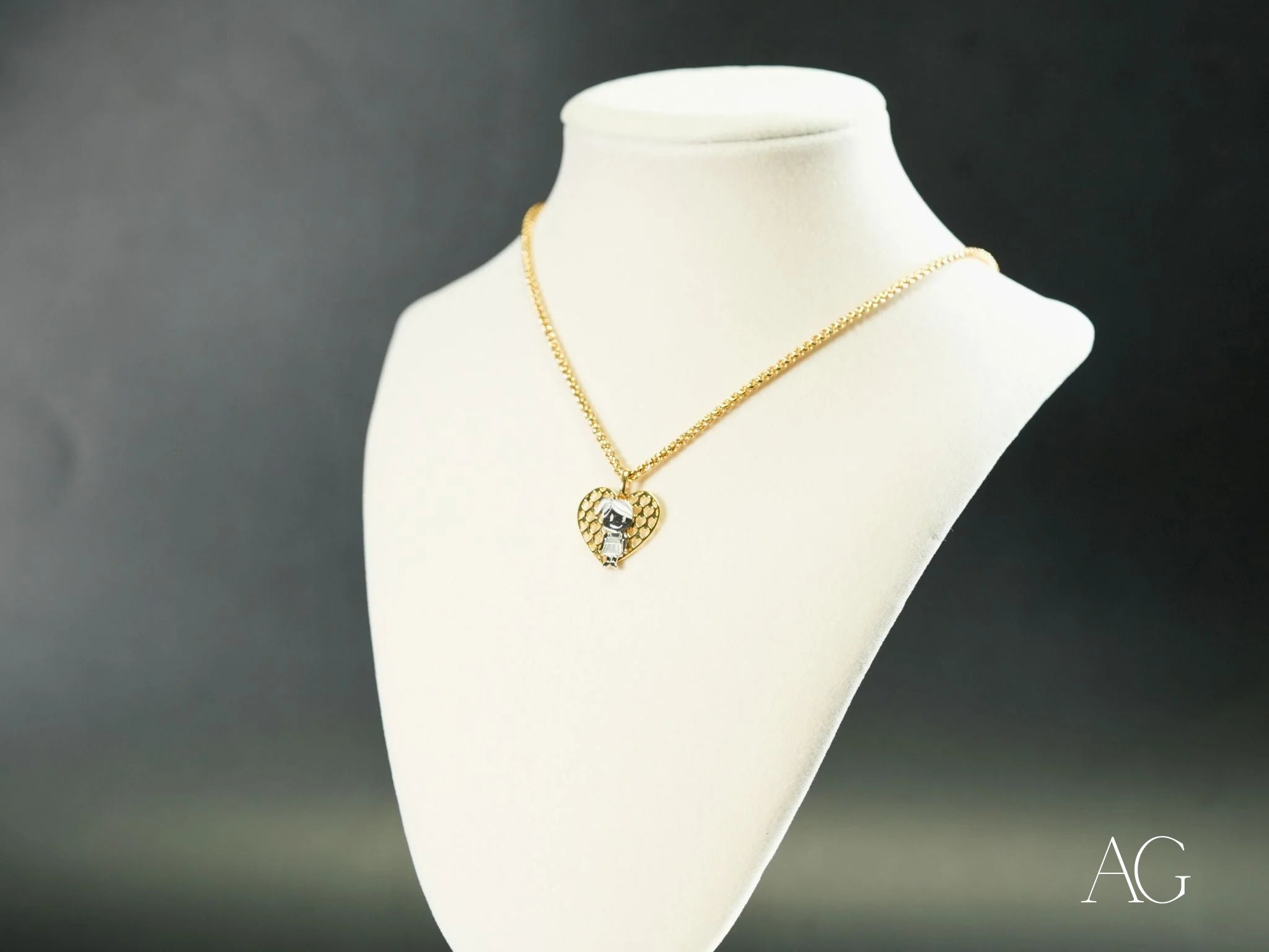 Gold heart-shaped pendant necklace with crystals on white bust, Golden Elegance 18k gold