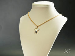 Gold-toned necklace featuring a butterfly pendant from the Golden Son collection