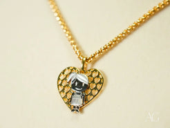 Gold heart-shaped pendant necklace with 18k Gold Doll Pendant charm in Golden Elegance