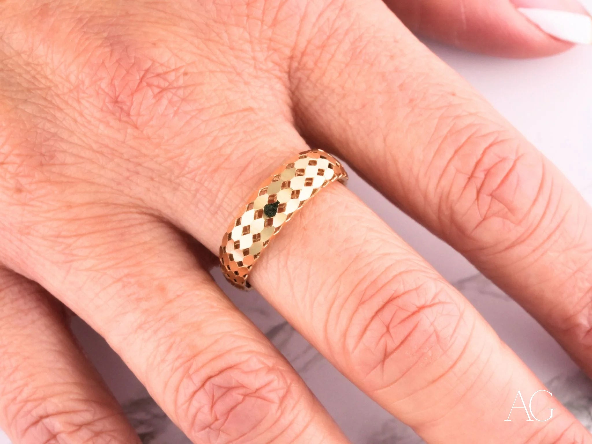 Gold ring with a latticed pattern showcasing Golden Mesh Elegance in 18k gold