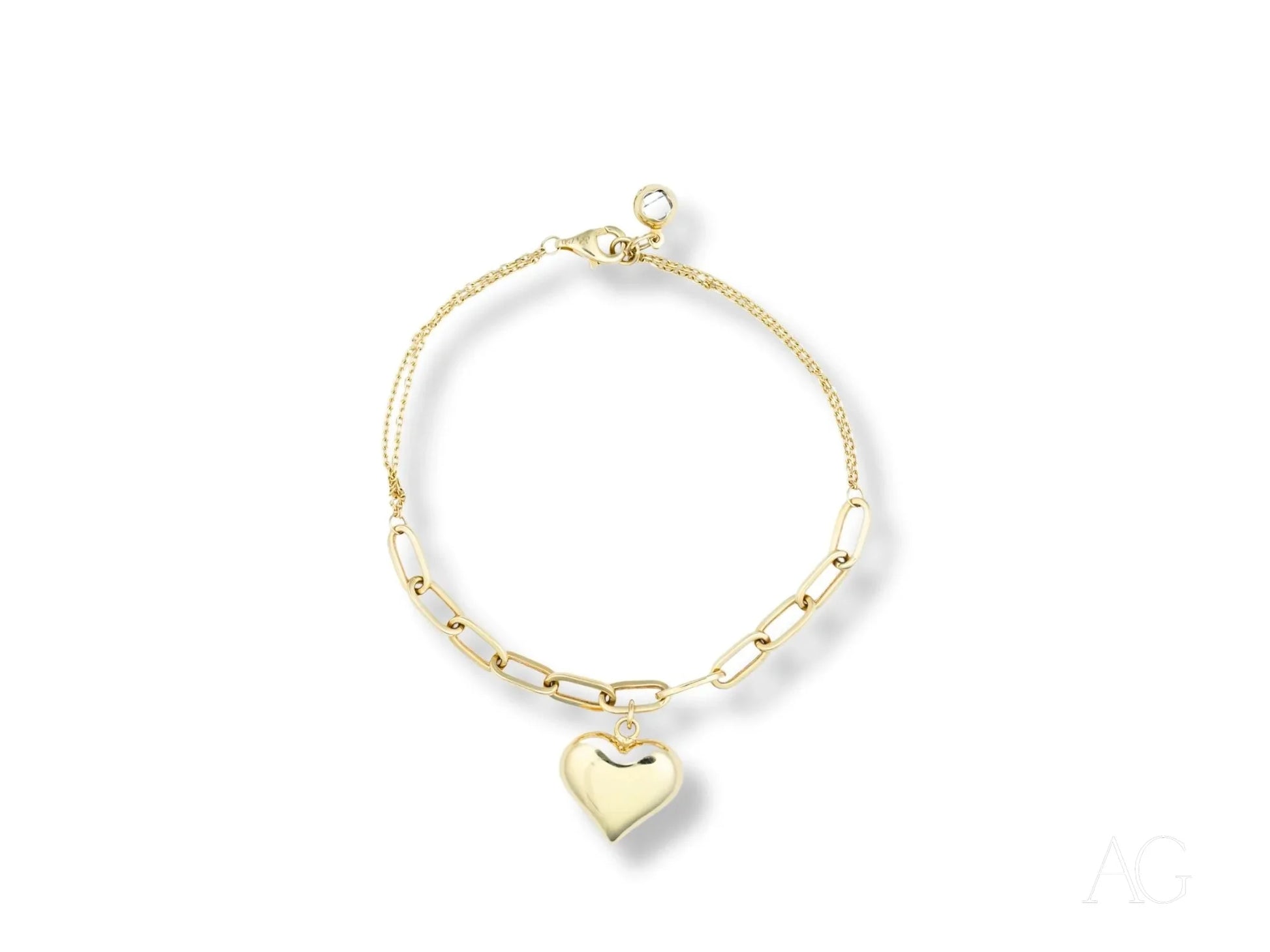 Delicate 18k gold bracelet with heart motif charm pendant for elegant jewelry