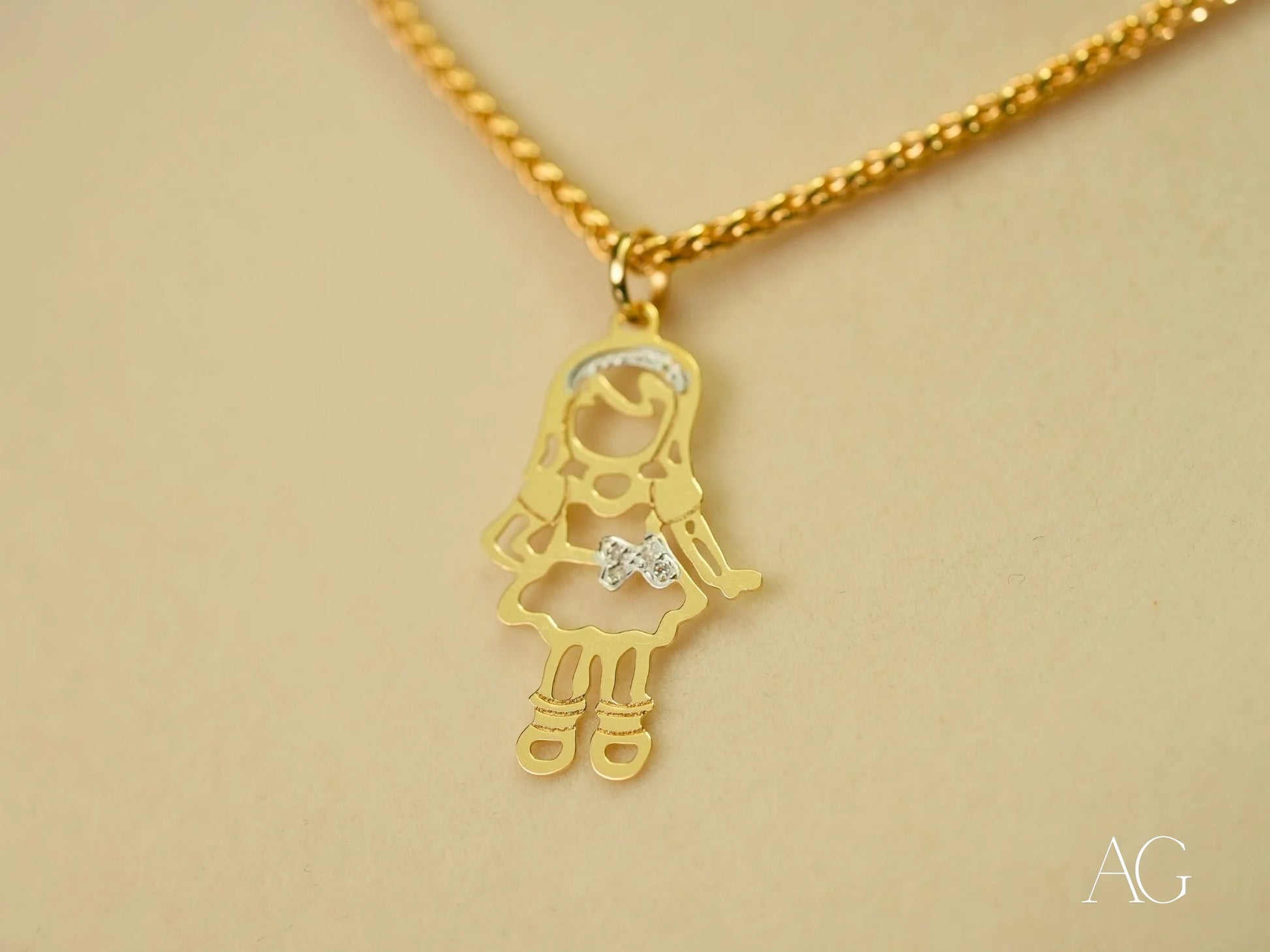 Gold pendant necklace with girl charm and diamond accent from Golden Treasures Pendant