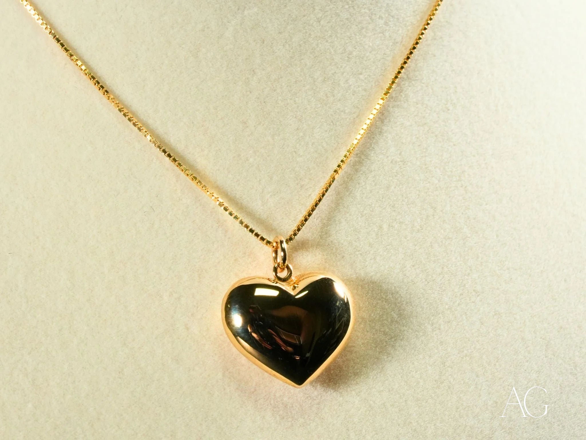 Gold heart design pendant on delicate chain necklace from Golden Embrace in 18k gold