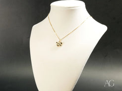 Gold-colored Butterfly Pendant Necklace in Solid 18k Gold displayed on a white bust