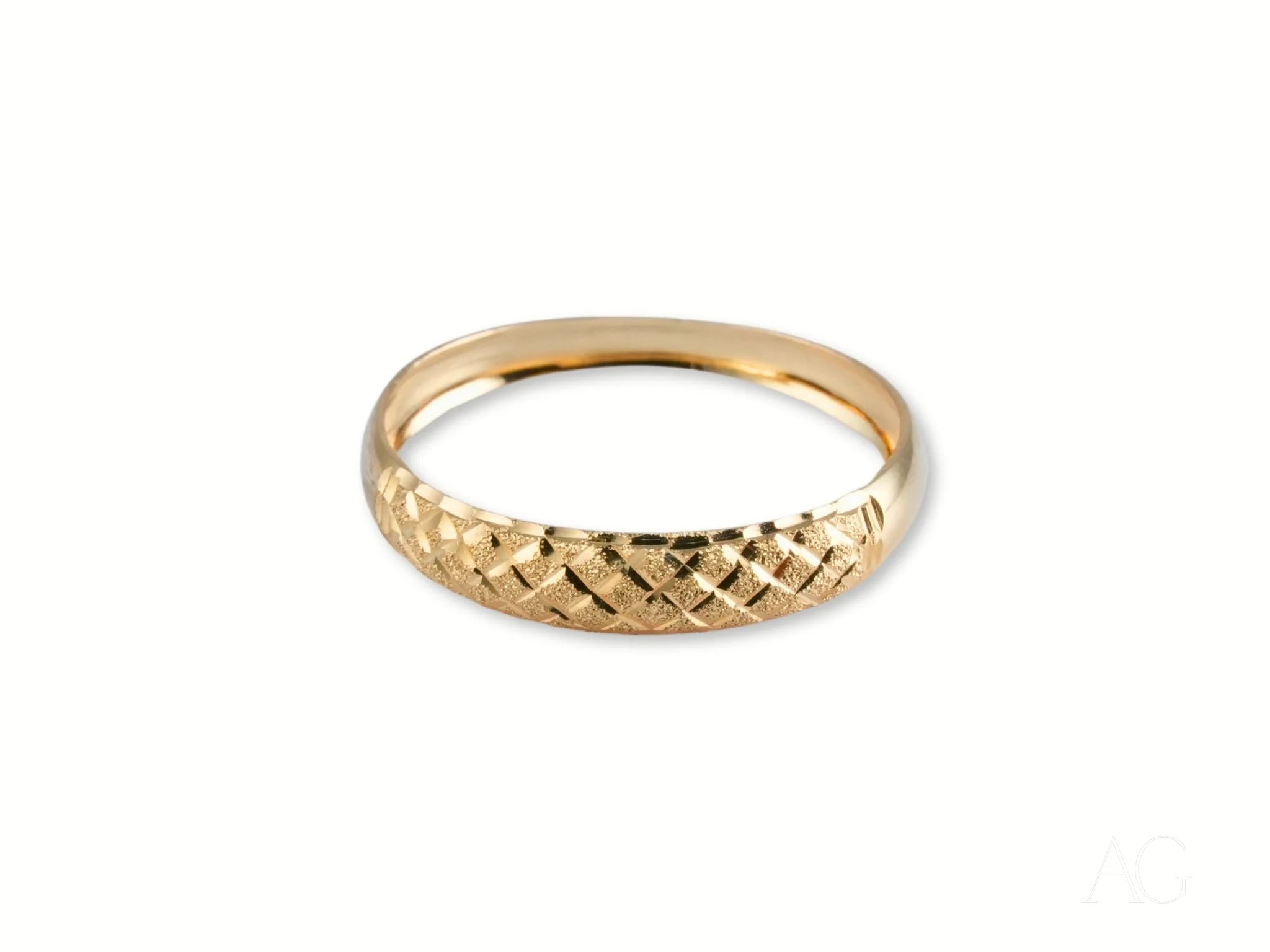 Gold ring with diamond-cut pattern from Golden Grace 18k Aparador Ring collection