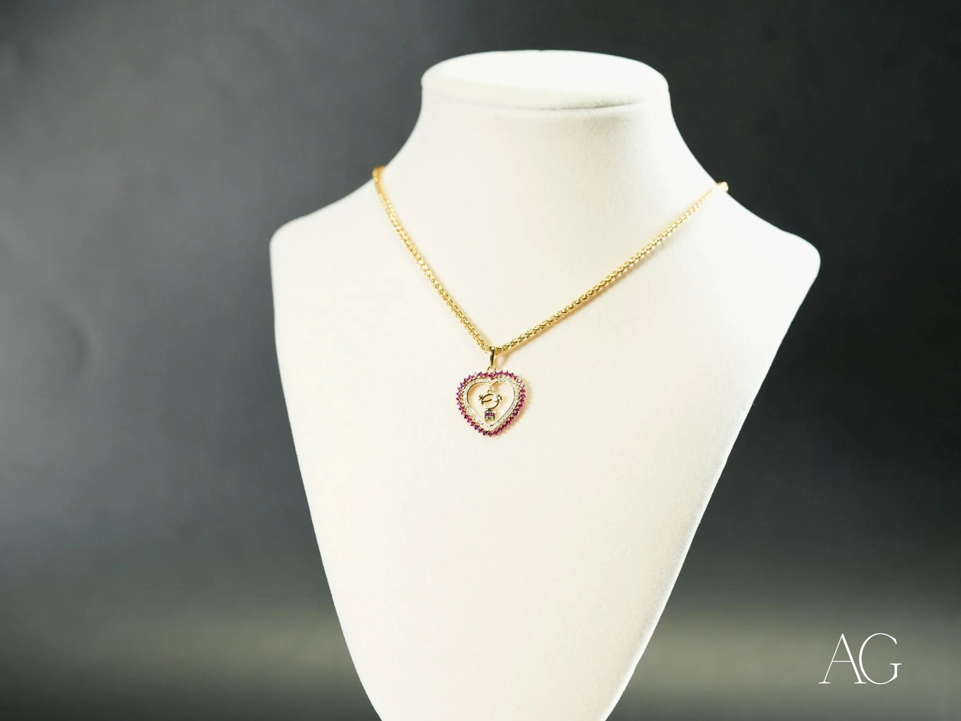 Gold heart-shaped pendant necklace with red CZ accent from Golden Passion in 18k gold