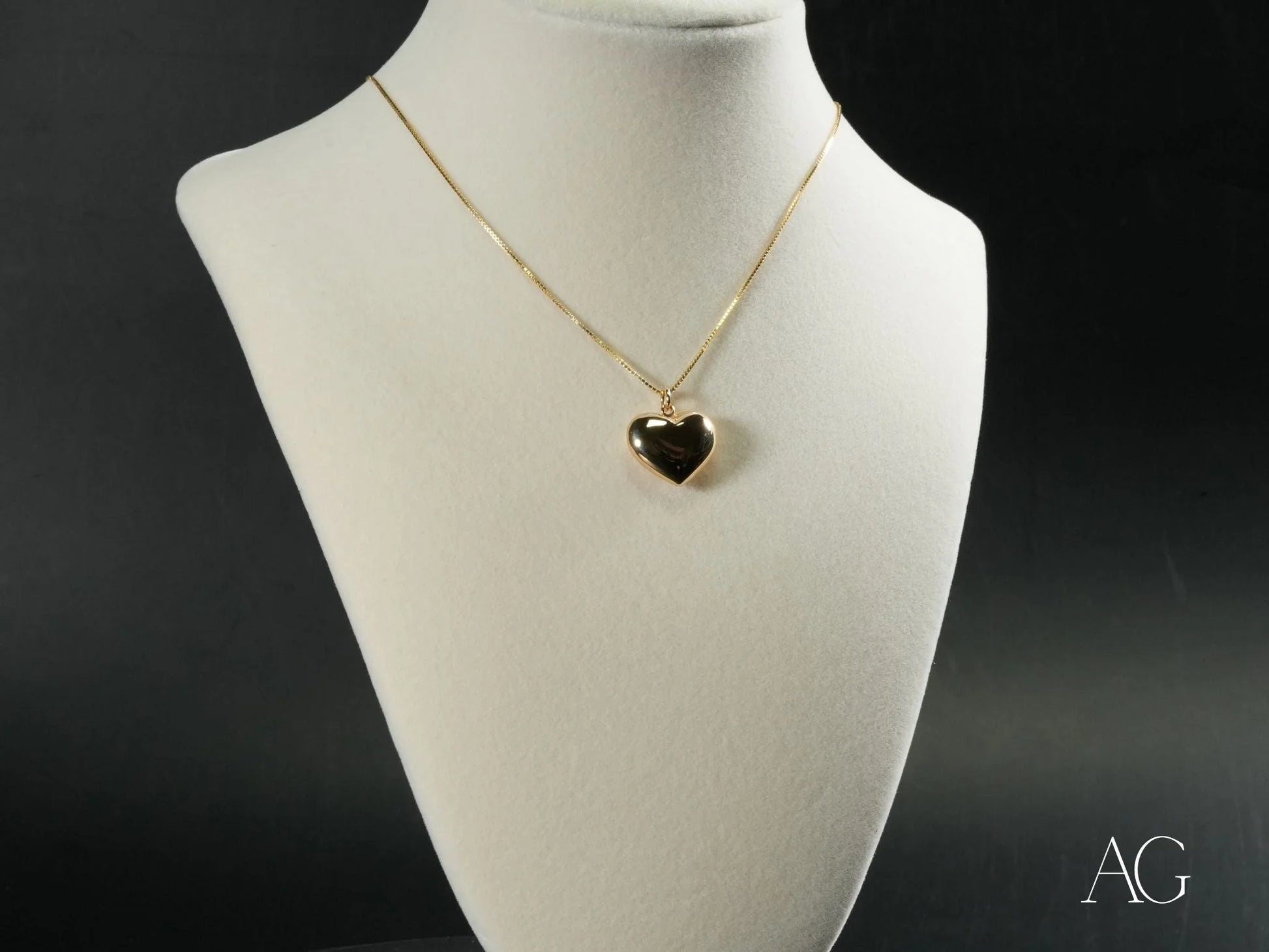 18k gold Golden Embrace Heart Pendant with a stylish black heart-shaped design