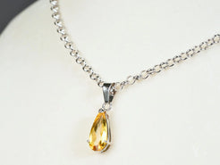 Silver chain necklace featuring a teardrop yellow citrine pendant in 18k white gold