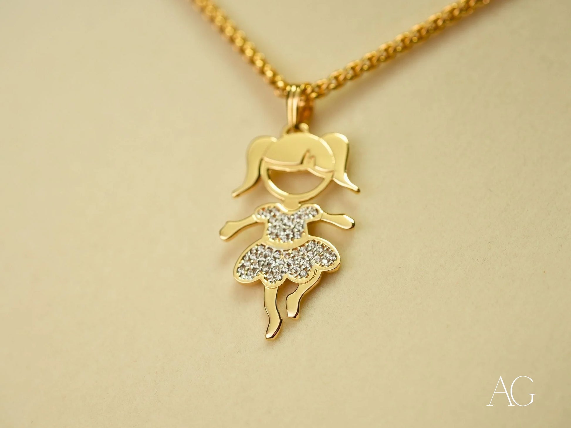 Gold pendant necklace with girl dancing silhouette and rhinestone accents in 18k gold