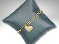 18k gold chain bracelet with heart motif charm showcasing elegant style and luxury