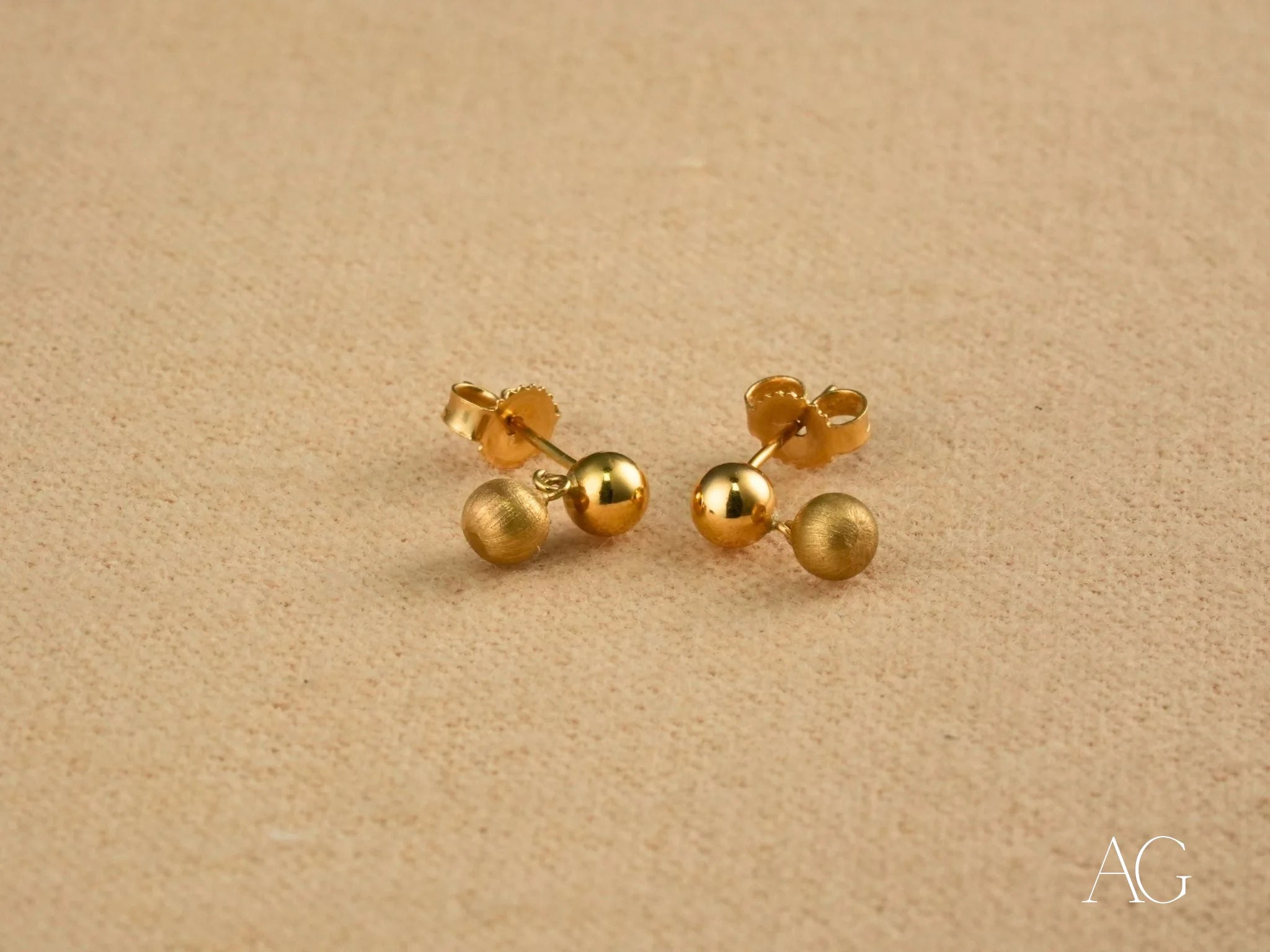 Pair of brushed 18k gold ball drop earrings for elegant accessorizing