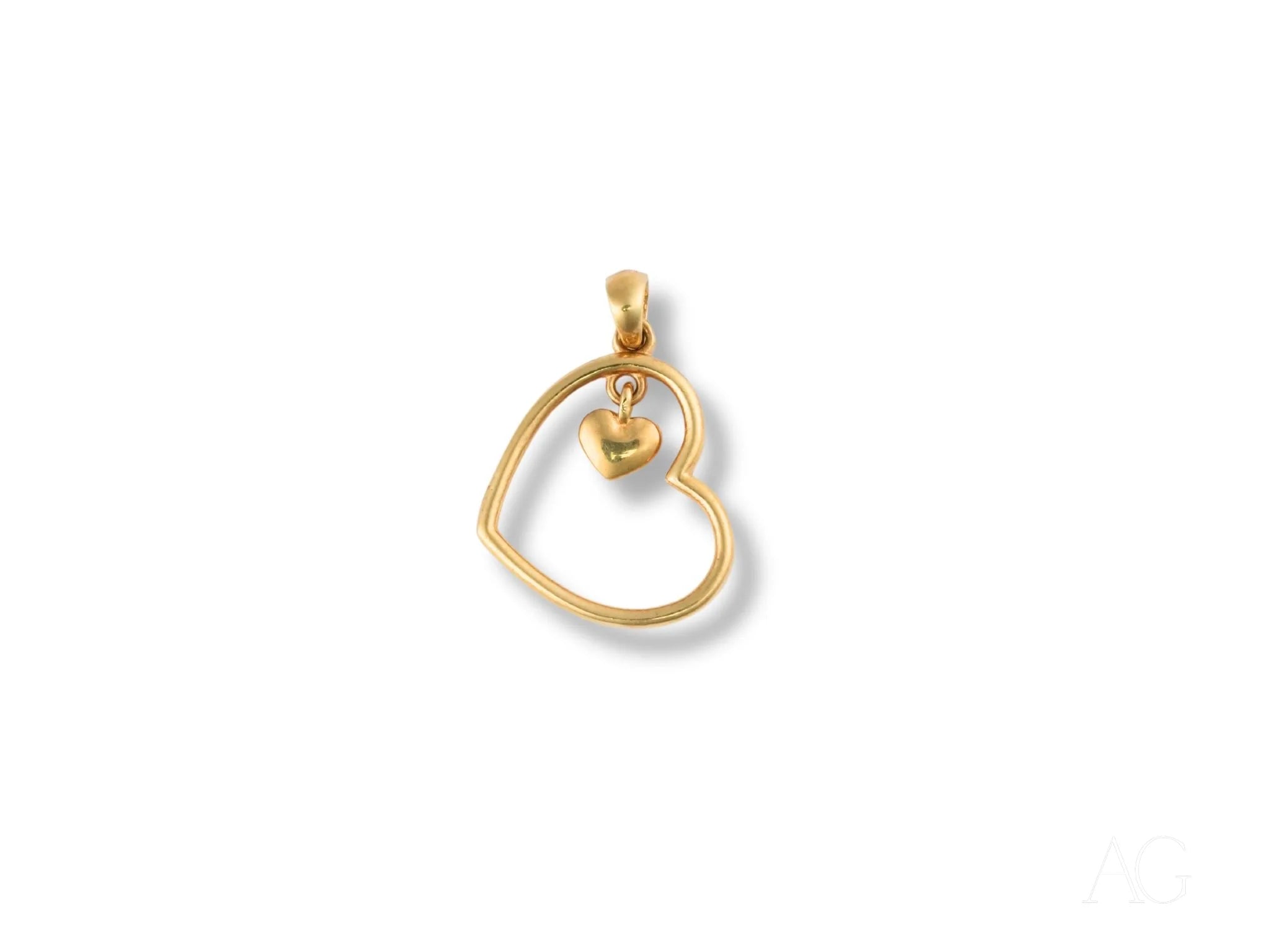 Gold heart-shaped pendant with open design in 18k gold, perfect golden heart accessory