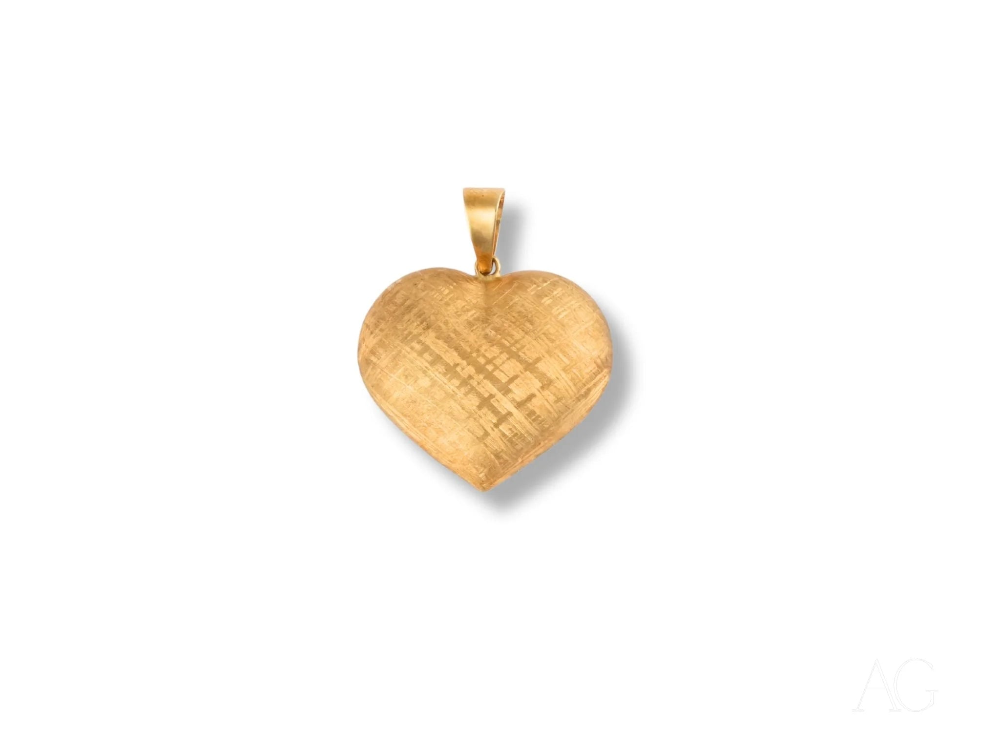 Gold heart-shaped pendant in brushed metal texture, crafted from 18k gold