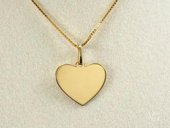 Gold heart pendant on a delicate chain necklace from the Golden Love Pendant collection