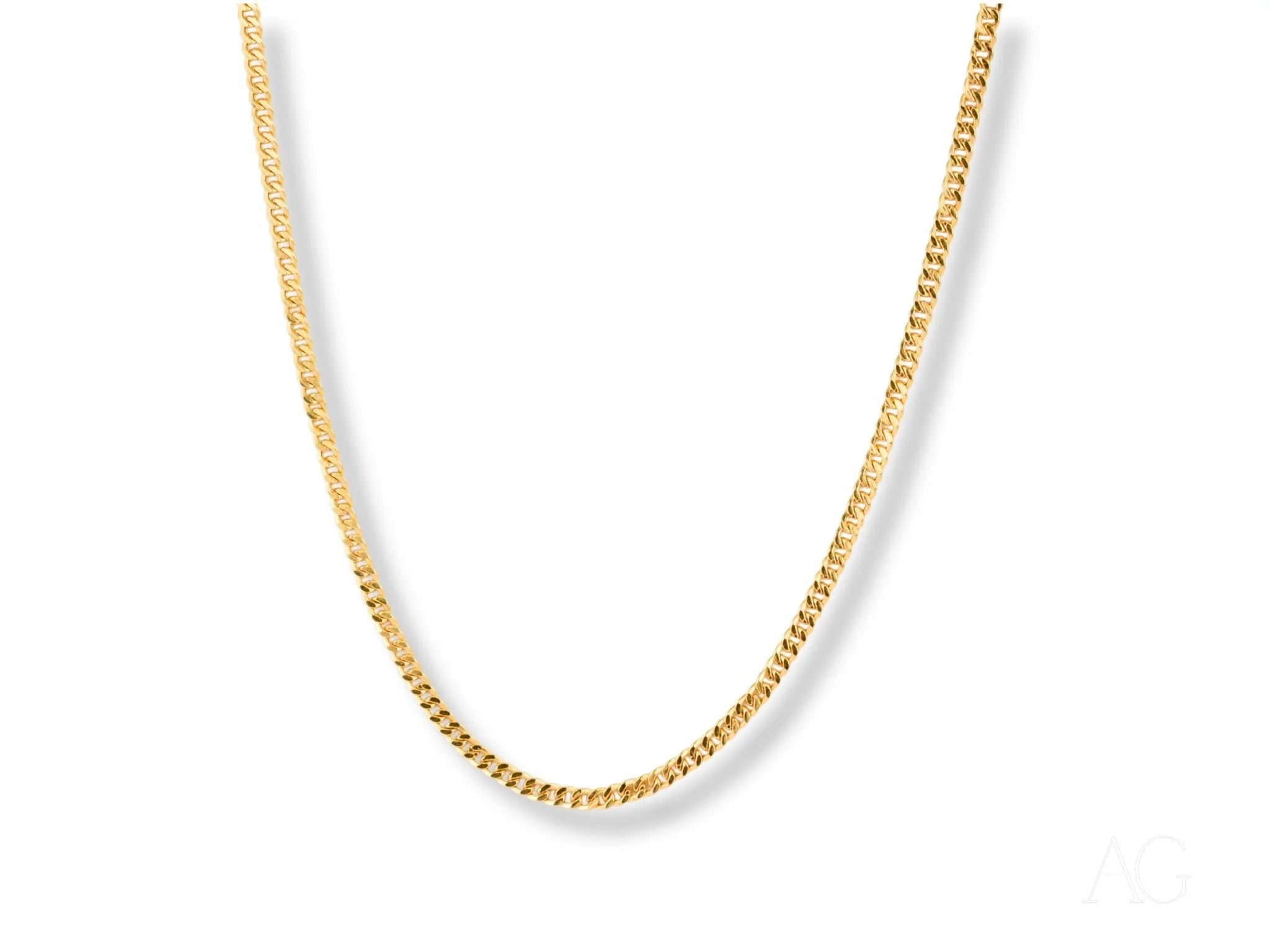 Gold curb chain featured in Golden Luxe Cuban Link Chain made of 18K gold