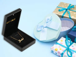 Gold necklace in black box with gift boxes, featuring a spring ring lock in 18k gold