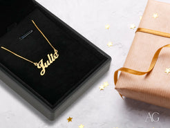 Gold-plated Julie name necklace in a black jewelry box with spring ring lock