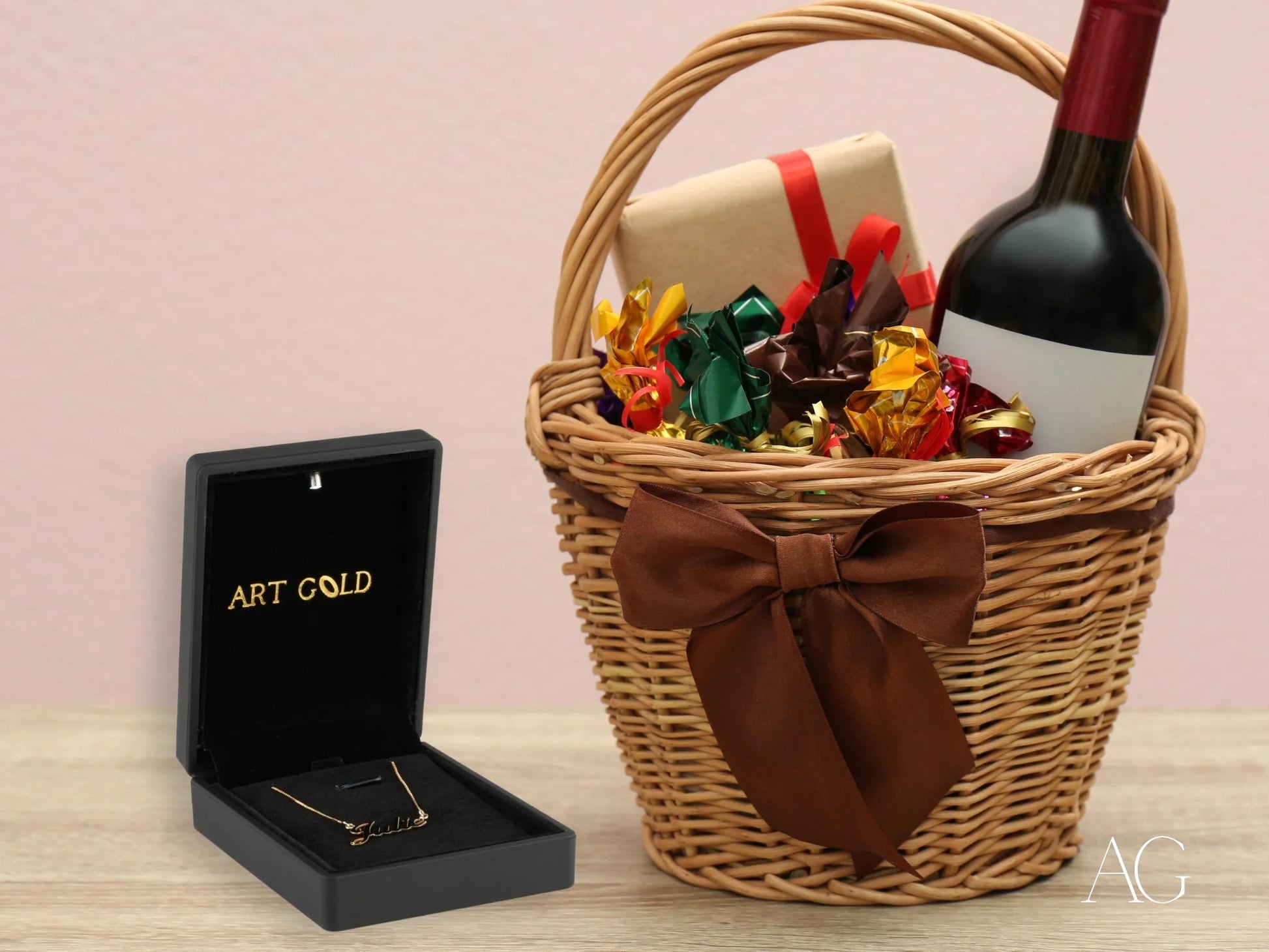 Woven basket with wine and chocolates next to 18k gold custom name necklace gift