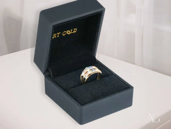 Gold ring with diamond accents in black box for Golden Spectrum 18k 3-tone ring