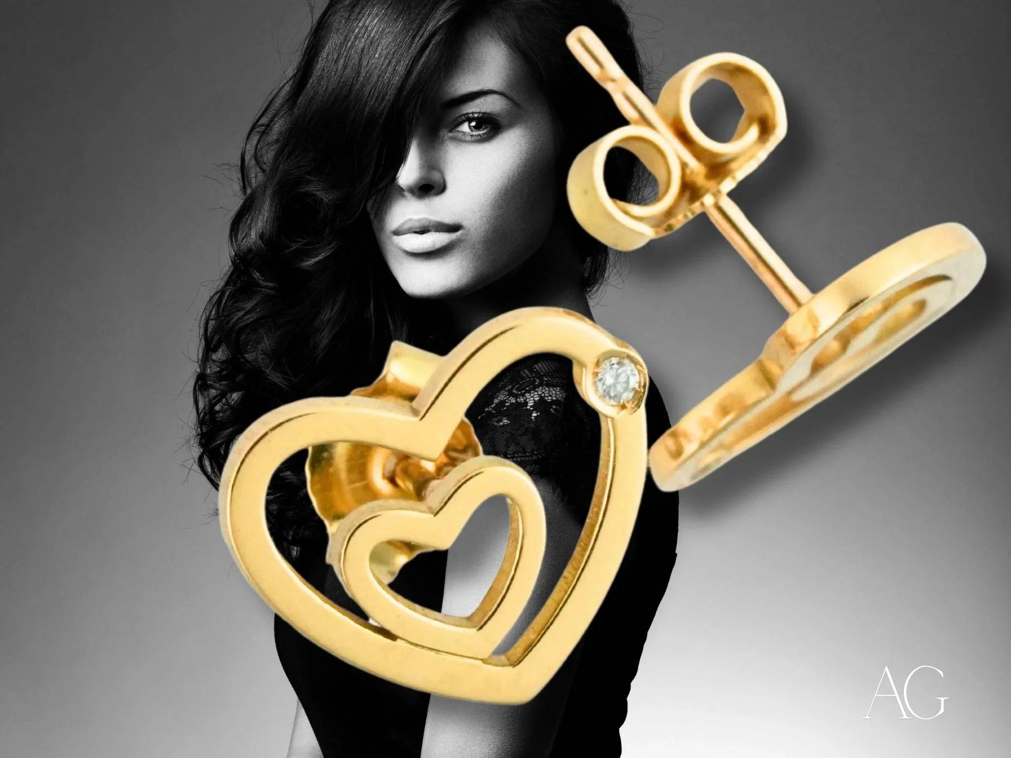 Gold heart-shaped earrings in 18k yellow gold with diamond accent from HHHH Collection