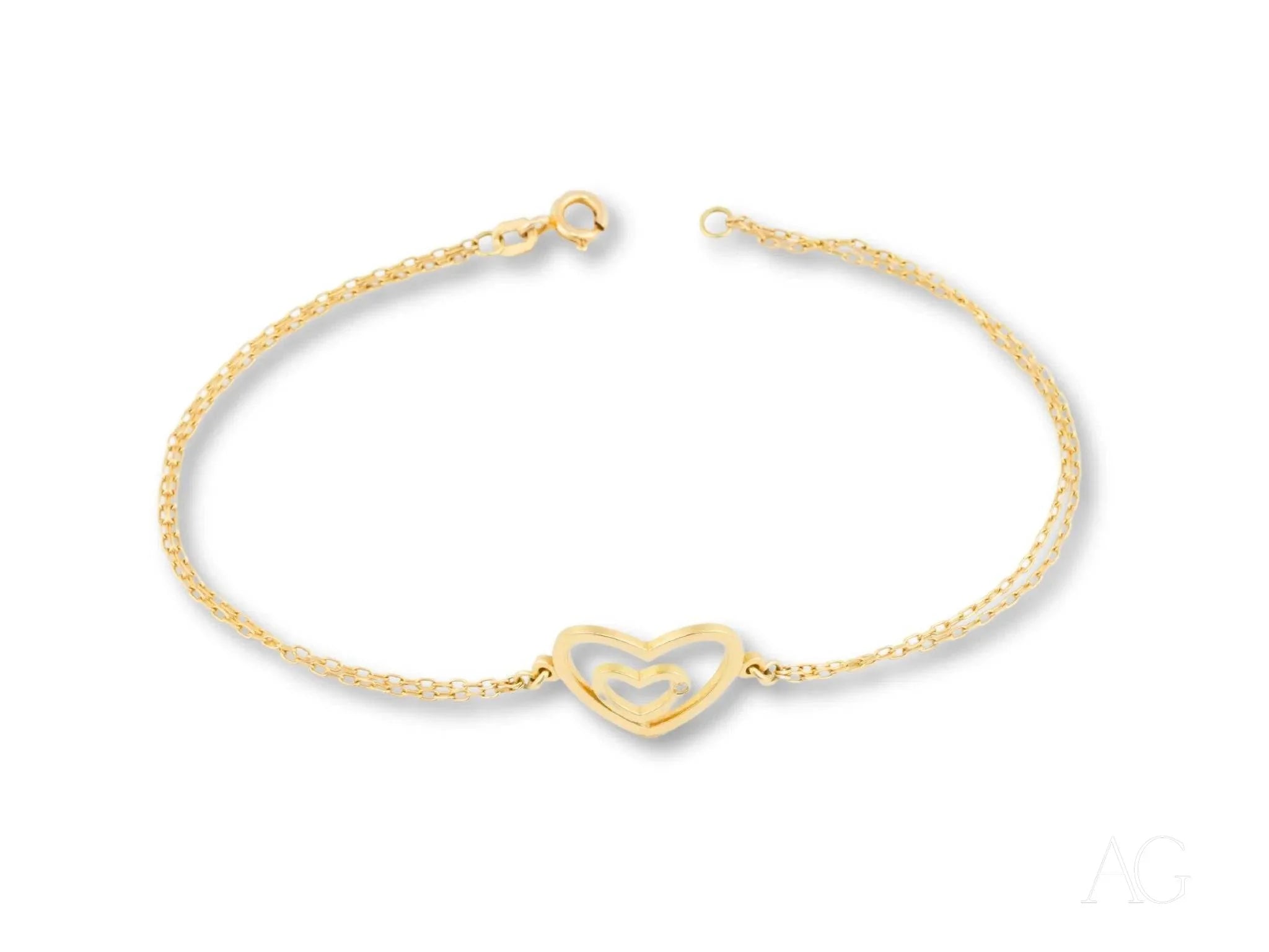 Delicate yellow gold heart bracelet with charm from the HHHH Collection