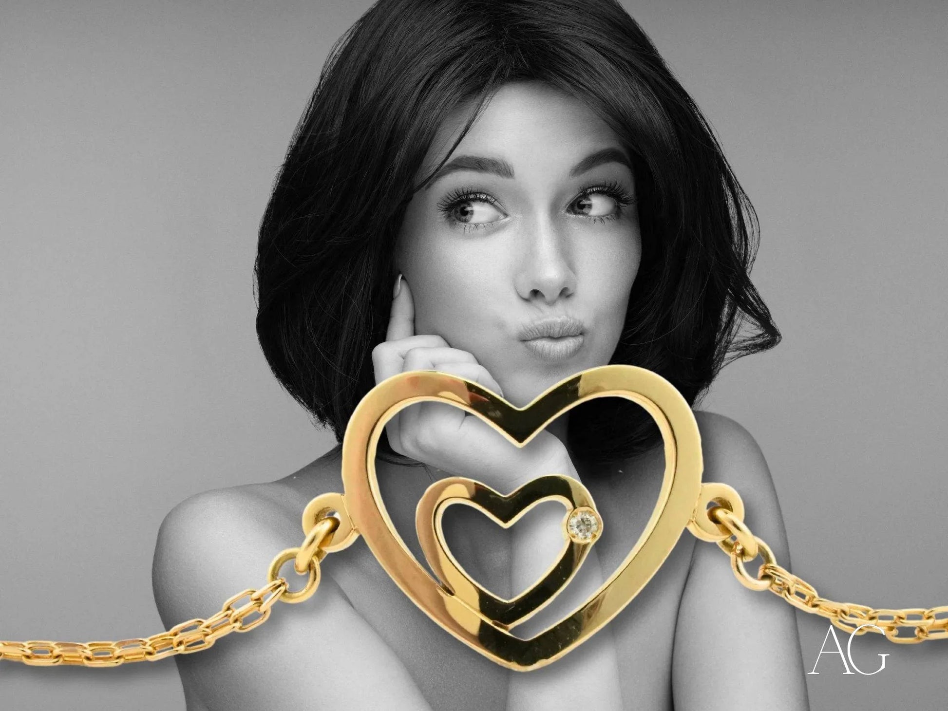 Golden heart-shaped pendant with nested hearts on a Heart Bracelet from HHHH Collection