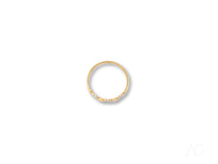 Elegant 18k yellow gold ring with small diamonds along one edge for a refined touch