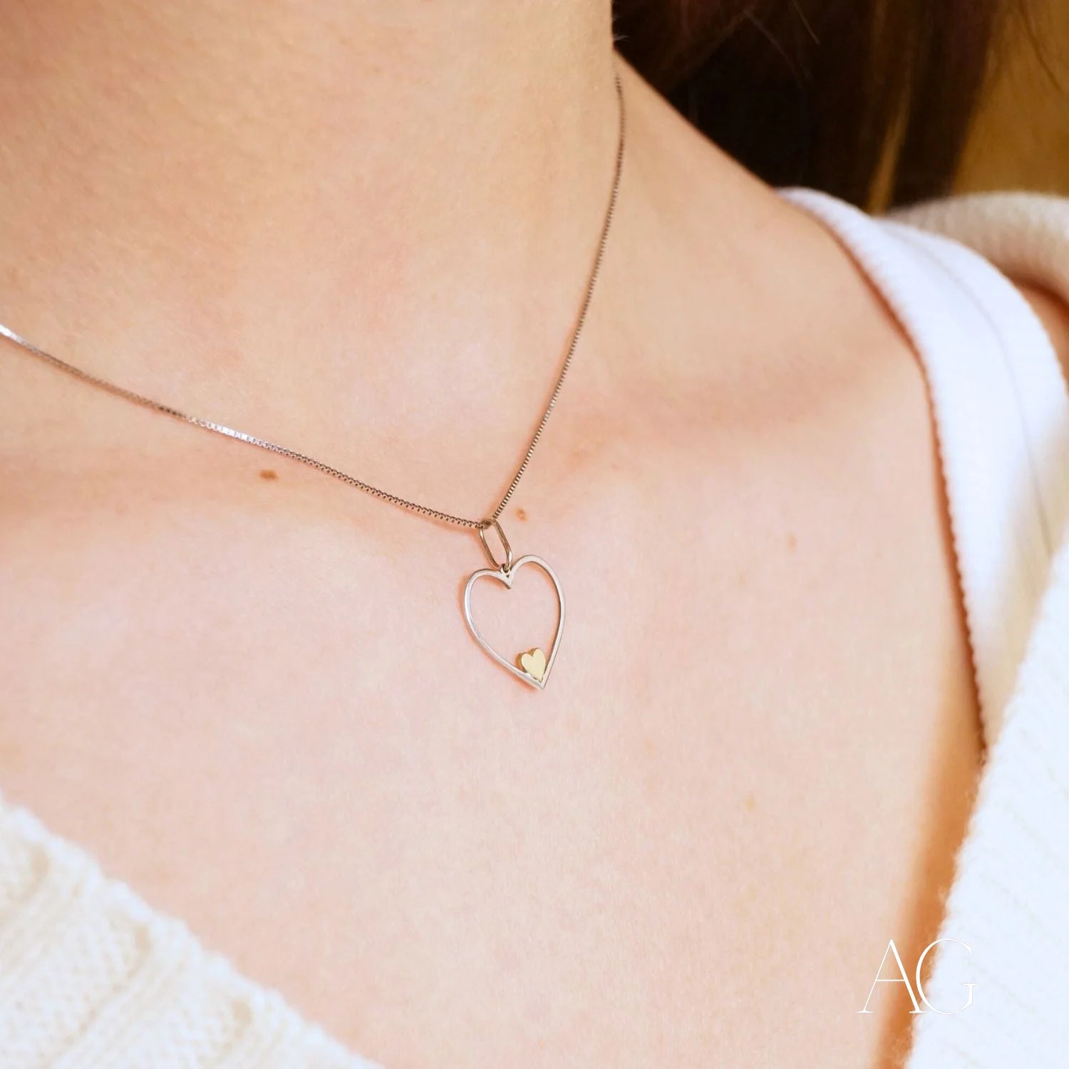 Heart-shaped sterling silver Eternal Love pendant with a heartfelt glint and gold accent