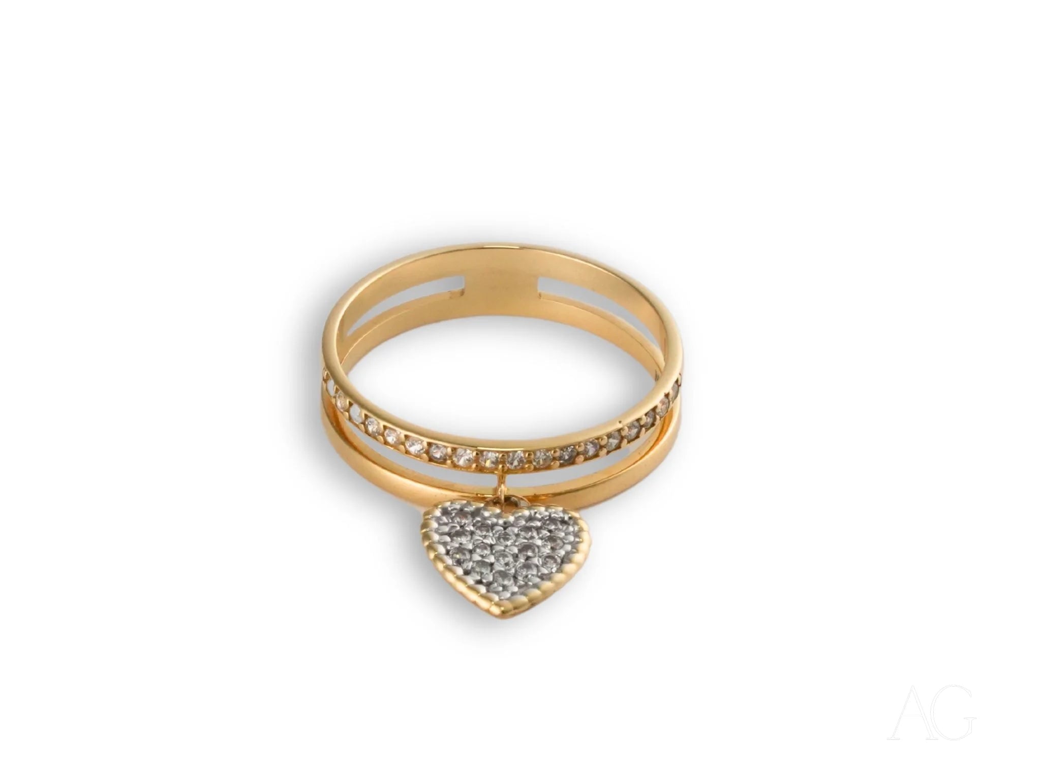 Heart’s Glow Ring in 18k gold with a dangling heart charm encrusted with crystals