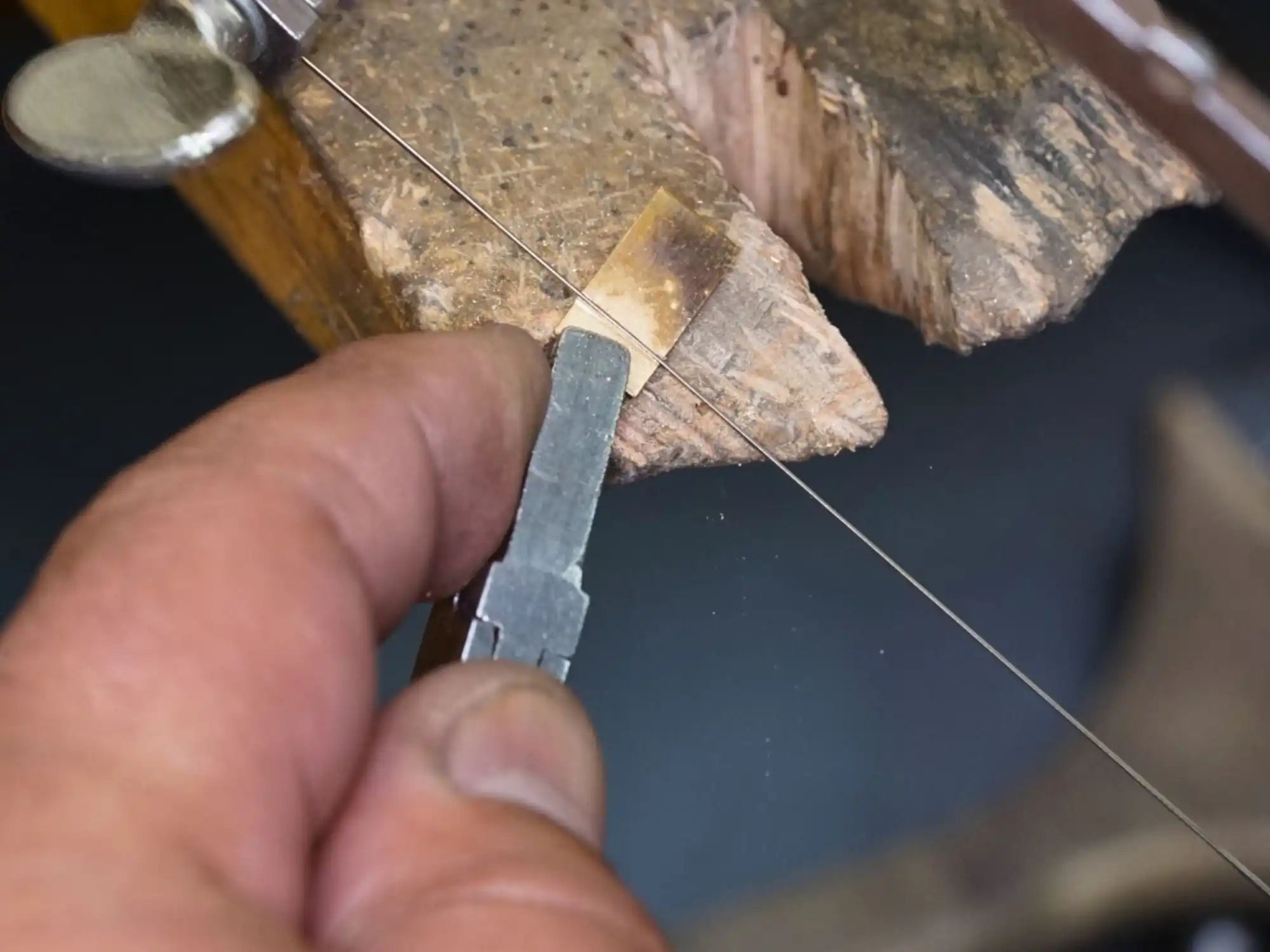 Jeweler’s saw cutting metal.