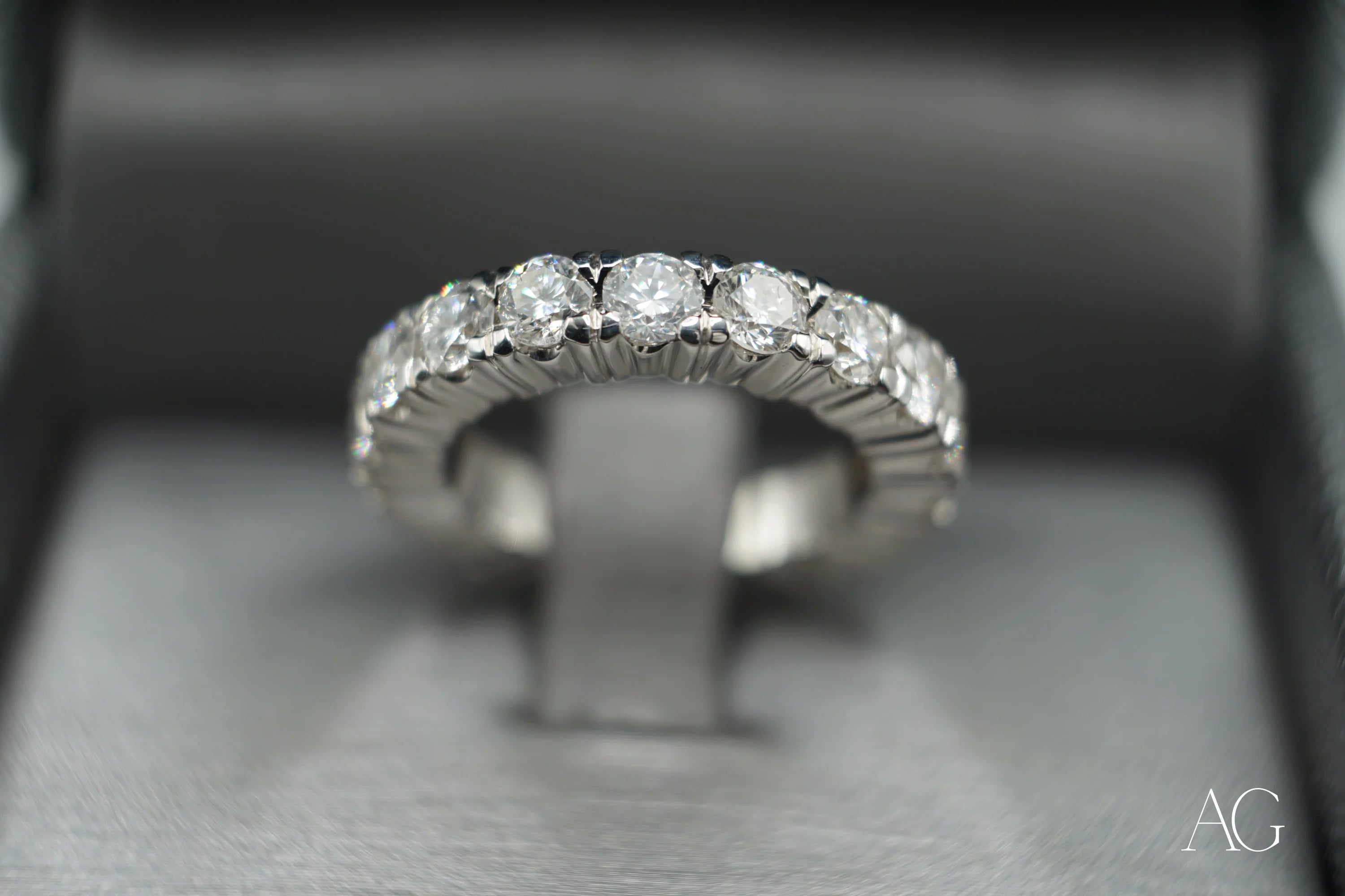 Diamond-studded white gold wedding band from Limitless Custom Jewelry Designs jewelry service