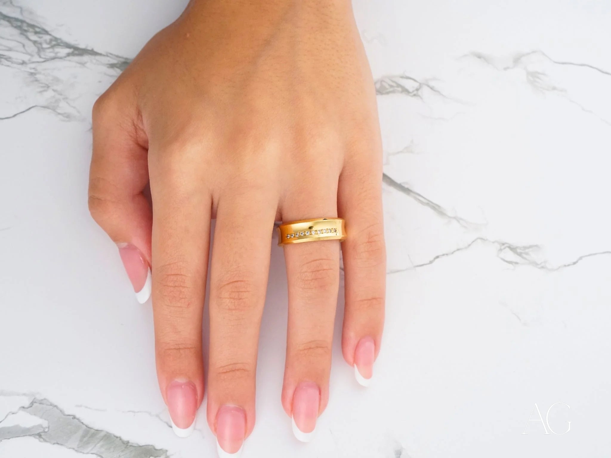 Gold 14k Wedding Band with engraved text on a finger, Luminous Path design