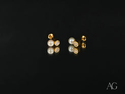 Lustrous Harmony 18K Gold Pearl and CZ Drop Earrings showcasing elegance and luxury