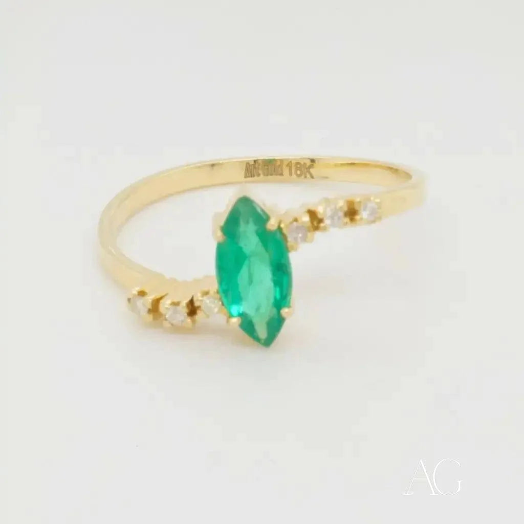 Gold Emerald Marquise Ring with Diamond Accents for a Luxurious Look