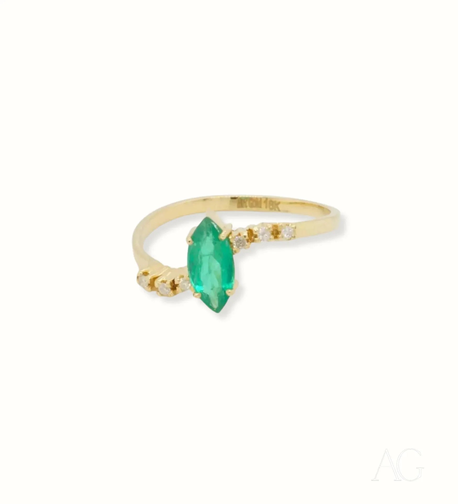 Gold ring featuring a stunning marquise-cut emerald gemstone for a luxurious emerald marquise ring